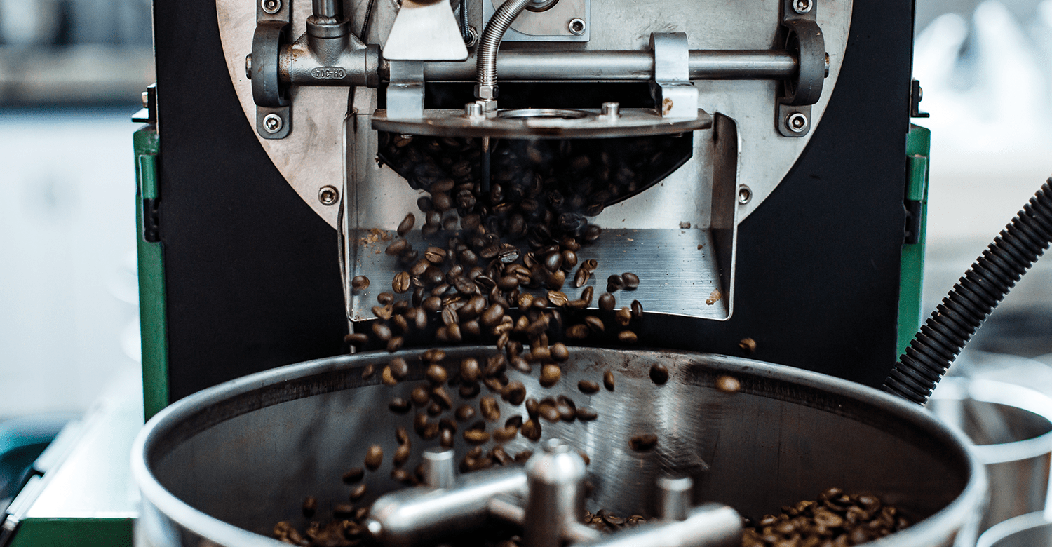 Beans being ejected out of of a coffee roaster