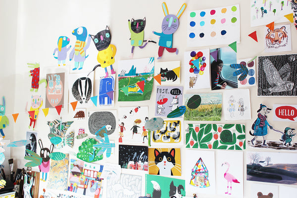 wall full of drawings and cut-outs in different colours