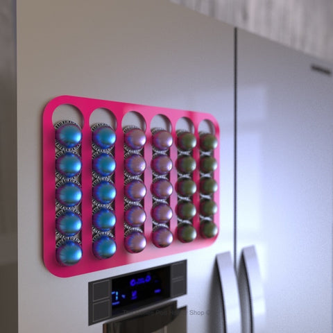 Magnetic Nespresso Vertuo capsule holder shown in pink on fridge door in kitchen