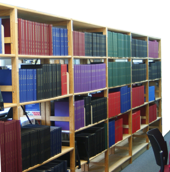 Volumes bound by The Bookbindery, in a library. Large number of binding colours.
