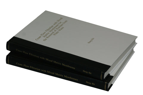 Thesis copies showing binding by The Bookbindery in a quarter bound style. (Spine in one bookbinding material and spine in another). This is one of the many options available at The Bookbindery.