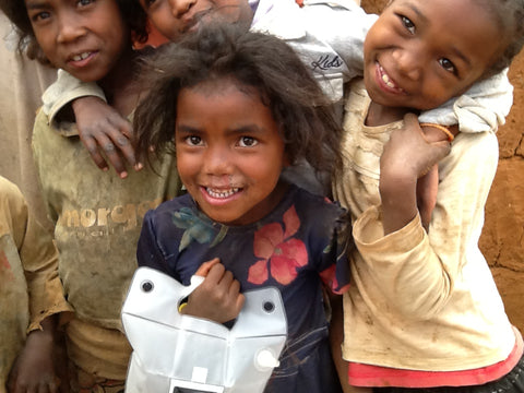 Children holding LuminAID solar lanterns in Madagascar