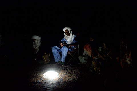 A man in Niger works after dark, though far from the grid