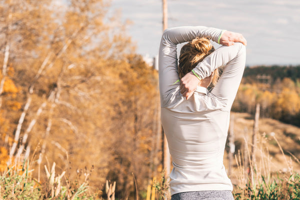 woman stretching in the park