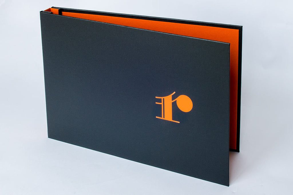 Orange Foil on Charcoal Buckram on custom portfolio