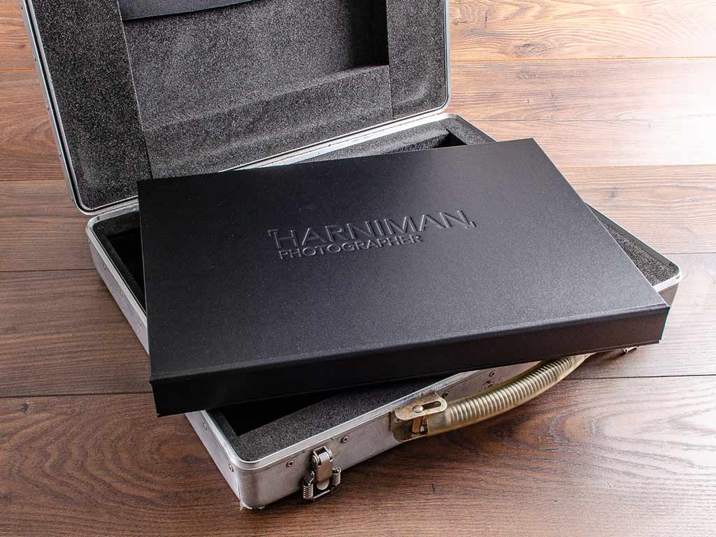 photography portfolio box sitting on carry case by hartnack and co
