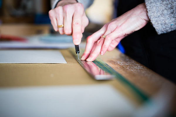 fabric being cut for exposed screw post portfolio