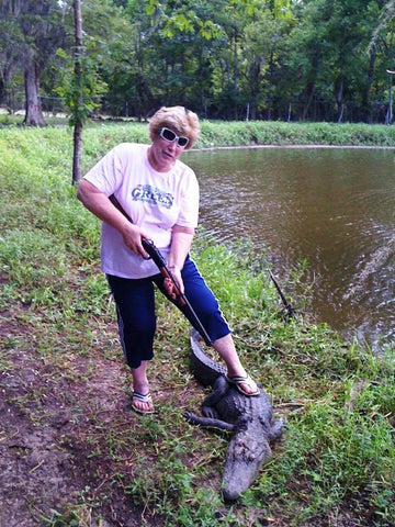 I'm the only gator in this swamp! Bayou Blake's mama, T-Lou, holds down a gator.