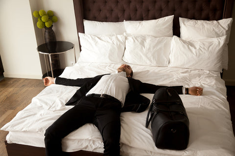 businessman sleeping on a bed