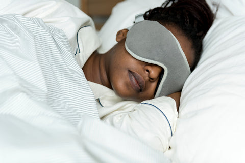 woman sleeping with a mask on