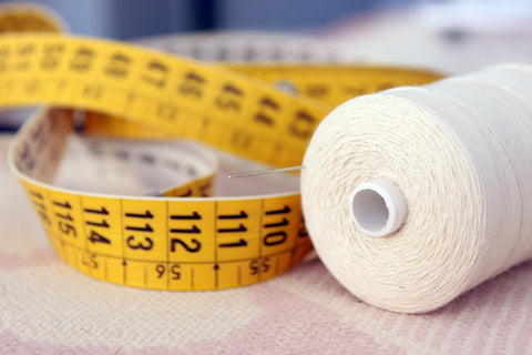 using measuring tape to find the right sized weighted blanket