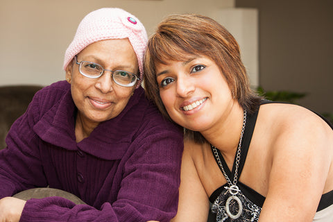 photo of a cancer patient and her daughter smiling.