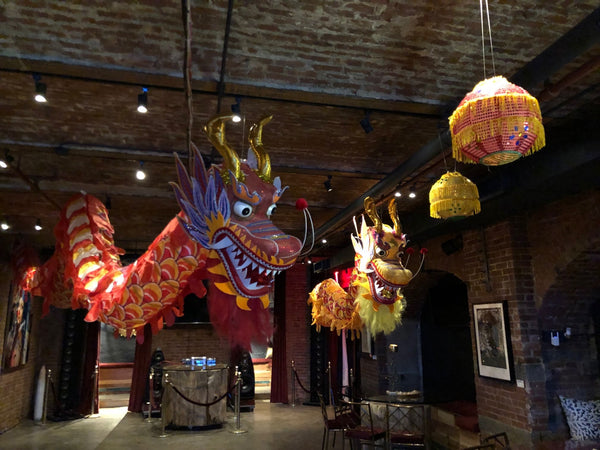 Large decorative dragons hanging for a birthday party