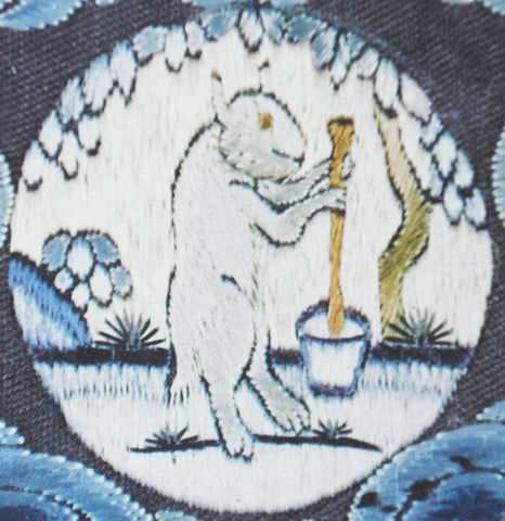 A cross-stitch of the jade rabbit with a mortar and pestle