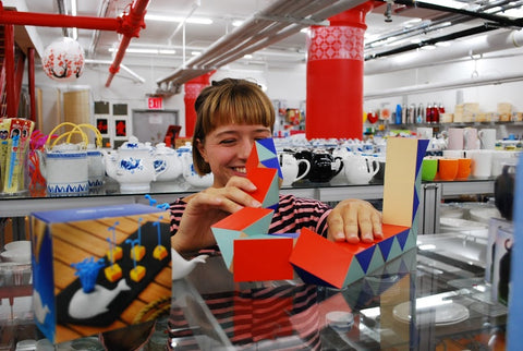 College student Aubri plays with a snake block toy