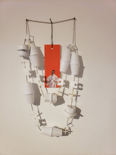 Necklace made of plastic creamers and butter containers