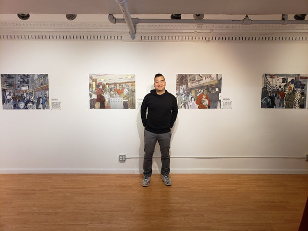 Artist Jerry Ma in front of some of his work in the Pearl River Mart art gallery