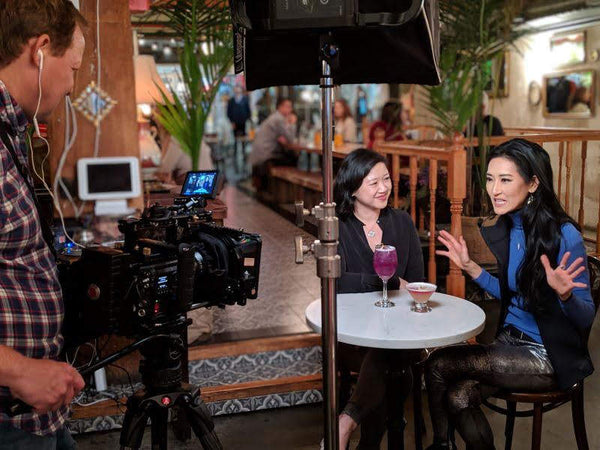 Joanne Kwong and TV host Kelly Choi filming a segment of Feed Me TV