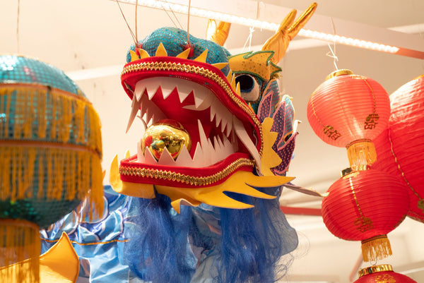 Close up of blue dragon decoration with gold ball in its mouth