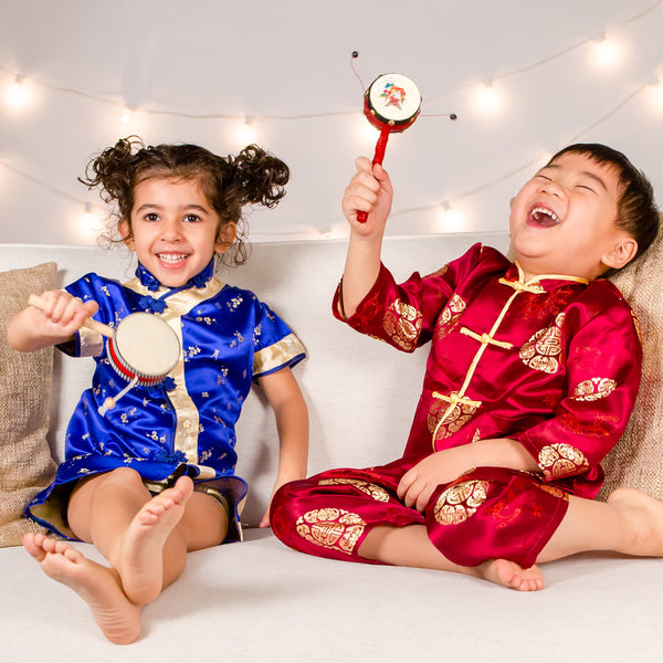 Children laugh and play in traditional Chinese clothes