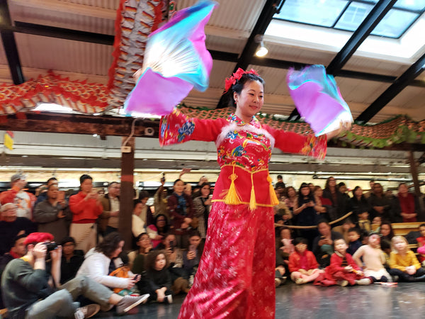 Dancer Ling Tang performing a fan dance at Pearl River Mart's Lunar New Year celebration at Chelsea Market