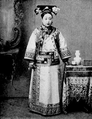 A woman wearing a 19th-century Manchu-style qipao