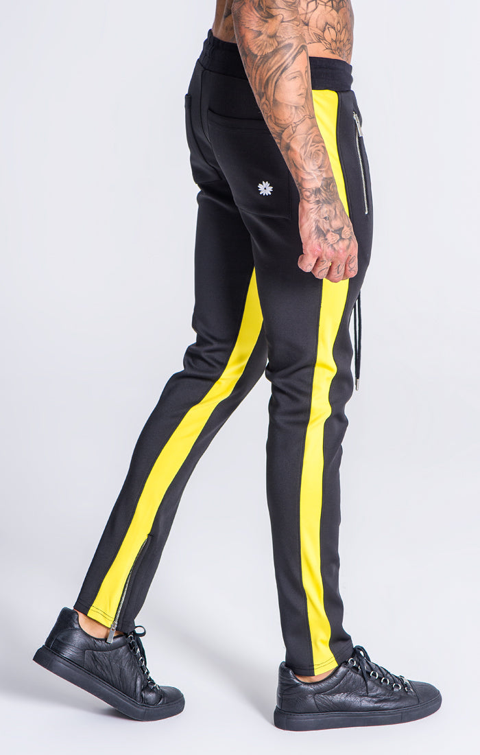 yellow joggers black stripe