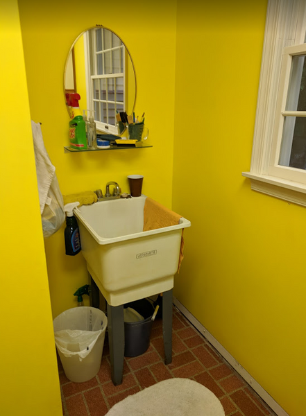 The bright yellow walls and brick print linoleum weren’t the vision Chris and Stacey had in mind. The functional laundry sink was great, but the unfinished look left a lot to be desired. With an active family, they also wanted to add a bench and cubby for additional storage and make the most of the space.