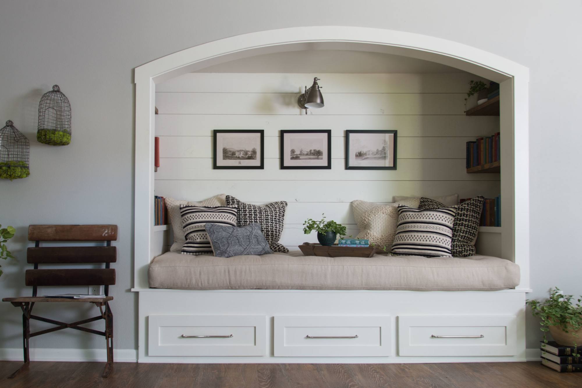 White shiplap reading nook accent wall