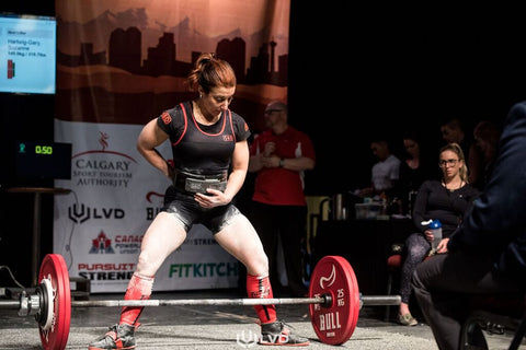 Female Powerlifter Preparing to Lift