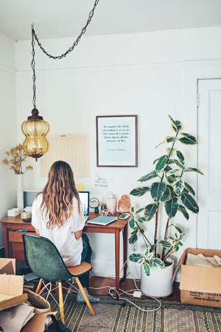 Home office | Cozy interiors | Ally Walsh of Canyon Coffee working on her desk at home in Venice, CA