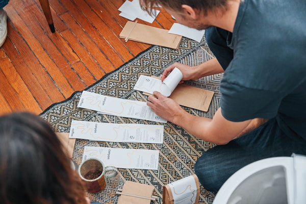 Working from home | Casey and Ally applying labels to coffee bags