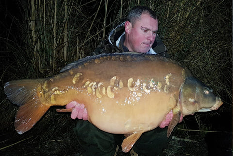 Chris with a lovely Mirror Carp
