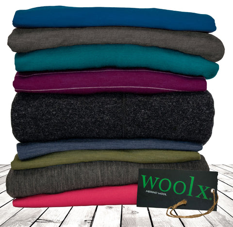 Woolx clothing in a pile