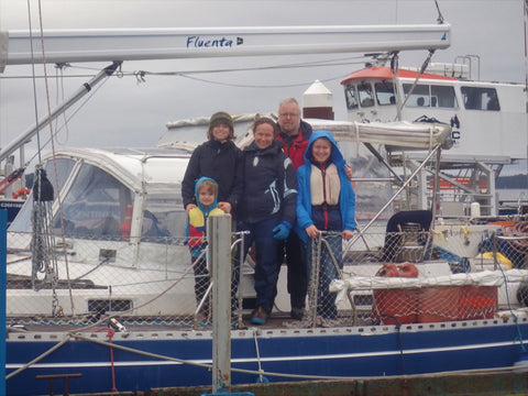 Family standing on boat
