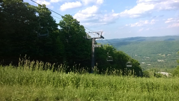 Ski lift shown in the spring on a mountain