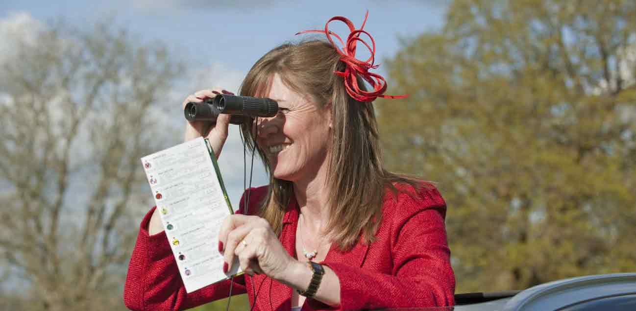 Woman using spectating binoculars 