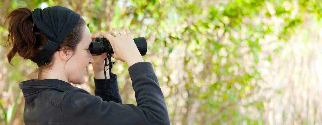 Woman using binoculars 