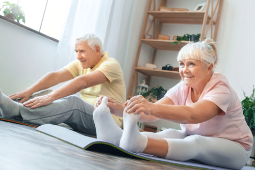 senior couple doing yoga