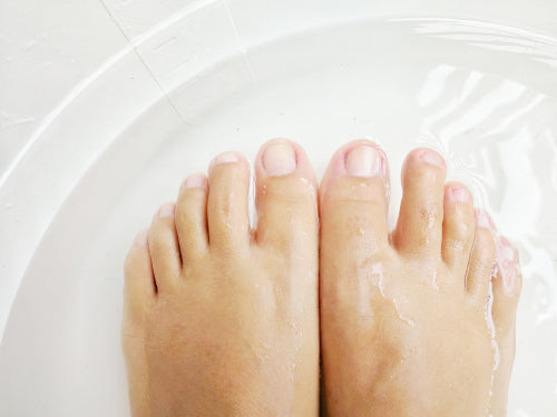 soaking feet in hot tub