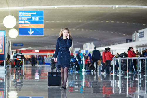 http://cdn.shopify.com/s/files/1/1499/5160/files/woman-walking-on-phone-at-airport.jpg?v=1555522419