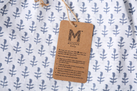 The wash care label on Malabar Baby's pajamas and loungewear