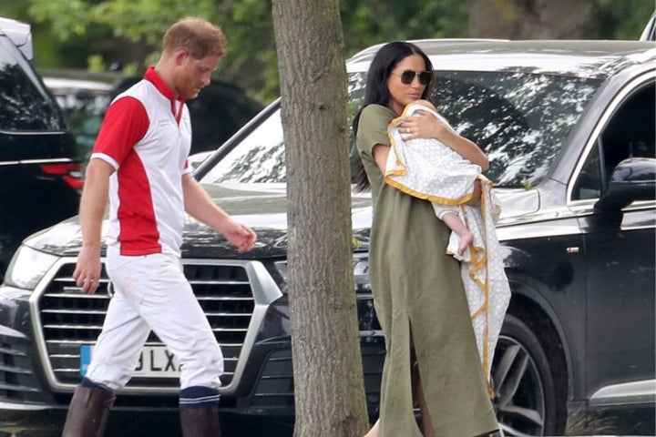 Duchess of Sussex Meghan carries baby Archie in a Malabar Baby blanket, while Prince Harry follows behind