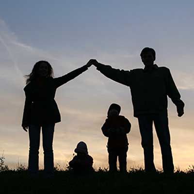 Shadow of family holding hands