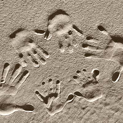 Handprints in the sand