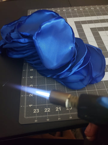 Torching satin flower edges