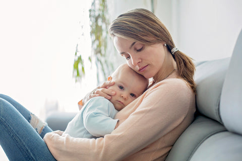 mom comforting baby with congestion