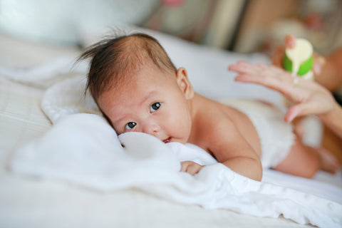 newborn laying on stomach