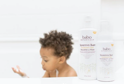toddler at bath time using Babo Botanicals Sensitive Baby Shampoo & Wash