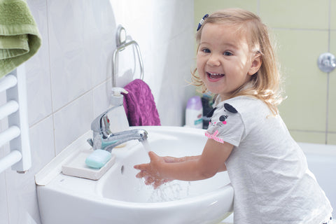 Little girl showing off her hand washing 